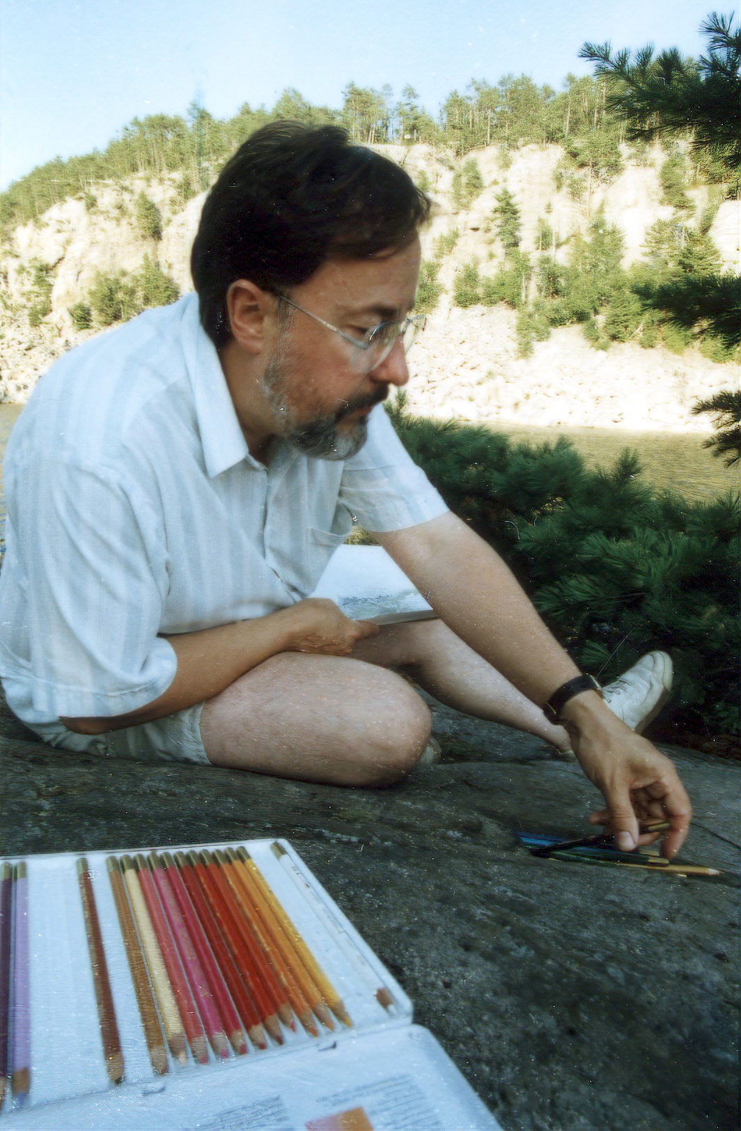 Glen Loates sketching in Temagami Ontario 1985
