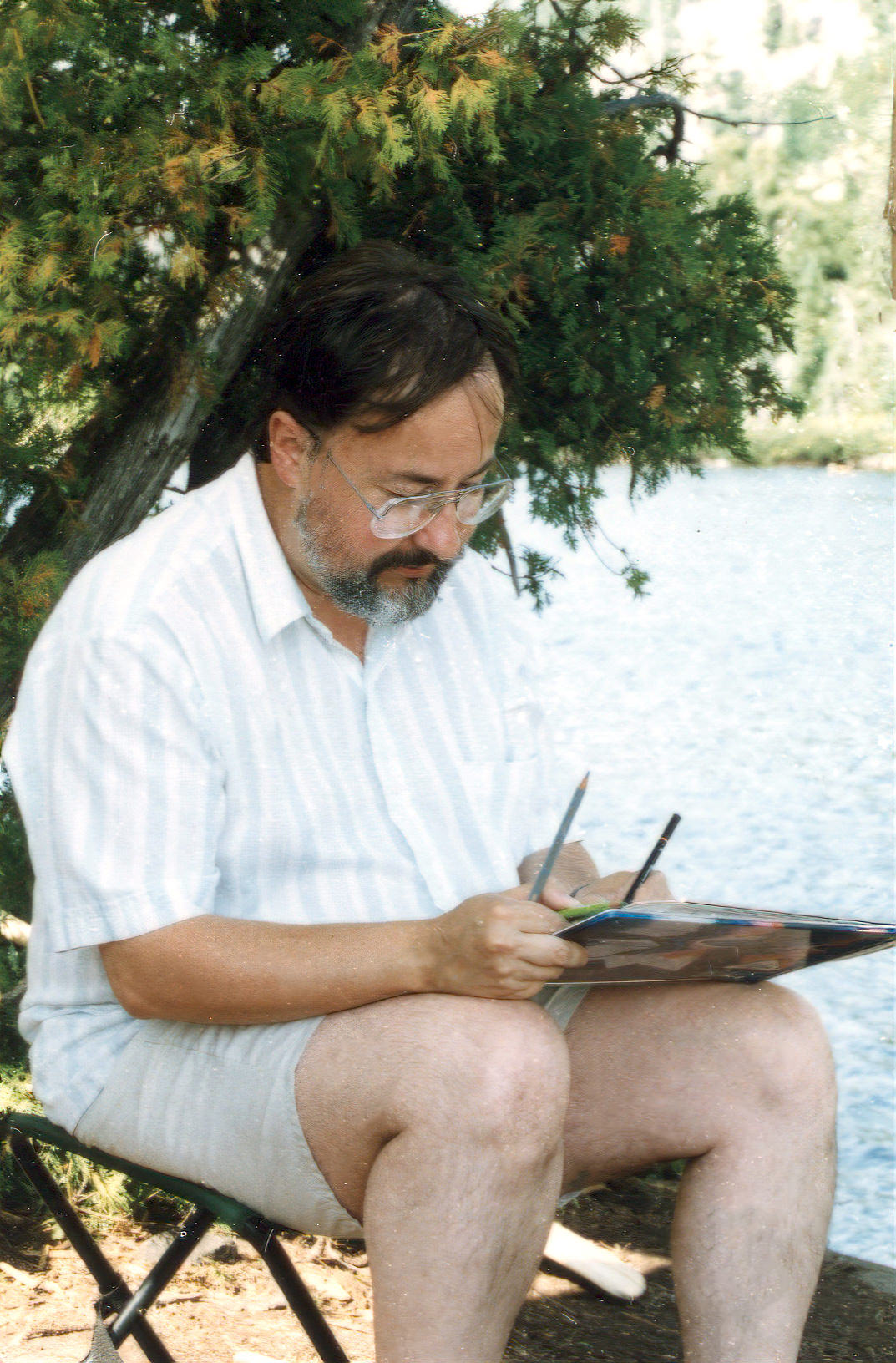 Glen Loates sketching in Temagami Ontario 1985